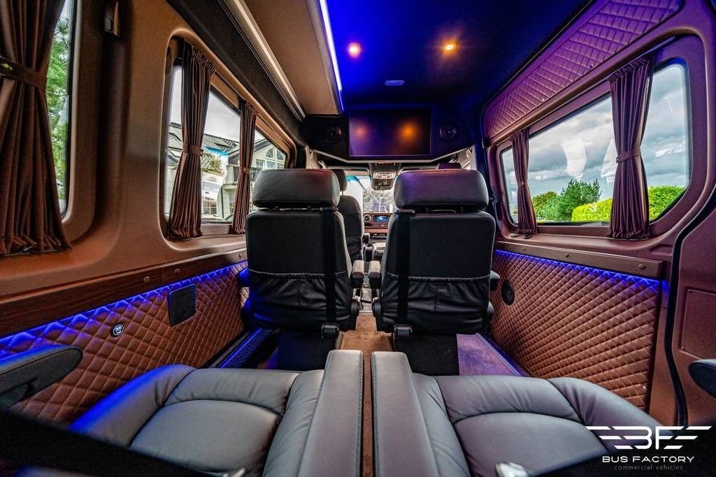 Leather seats, mood lighting and screens inside a luxury minibus used for day tours from Ballinderry Park